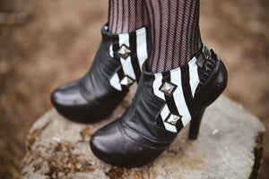 Striking black and white striped spats with pyramid studs